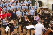 4. Tom conducting orchestra with choir ready to sing