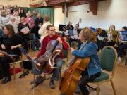 Altos checking sight lines and some of the orchestra