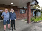 Two of our members wecoming visitors at the entrance to Wellspring Church